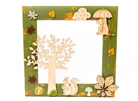 Rectangular wooden frame decorated with colorful autumn leaves on a white bac Stock Photos