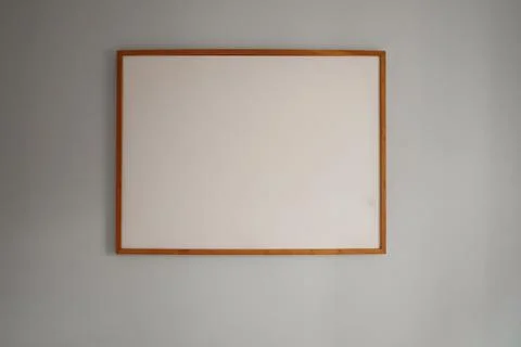 Rectangular wooden frame holding an empty white canvas for art or advertisi.. Stock Photos