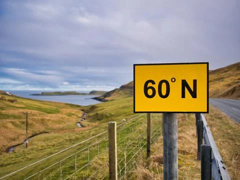 A rectangular, yellow sign with black figures on the A970 on Mainland, Shetland 写真素材