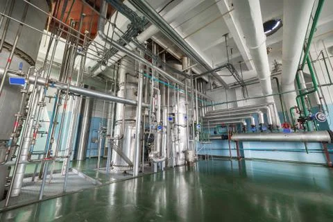The rectification shop. Silvery distillation columns Stock Photos