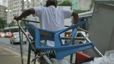 Recyclabe waste picker pulling his trolley Stock Footage 168536993