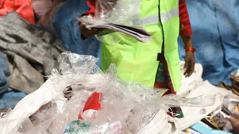 Recyclable waste pickers work on garbage separation, Stock Footage 128123918