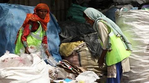 Recyclable waste pickers work on garbage separation, Stock Footage 128123922