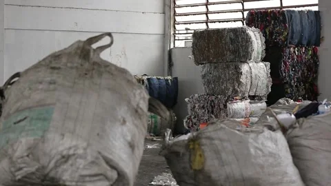 Recyclable waste sorting, close-up on hands, in Vila Prudente, São Paulo Stock Footage 317649043