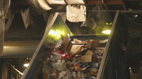 RECYCLABLES RISE TO SORTING PLATFORM Stock Footage 6530216
