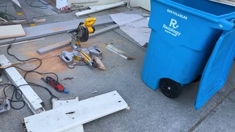 Recycle Bin Beside Carpentry Tools and Sawdust Stock Footage 313357950
