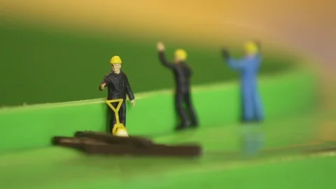 Recycle bin with miniature models watching slowmotion Stock Footage 102554715
