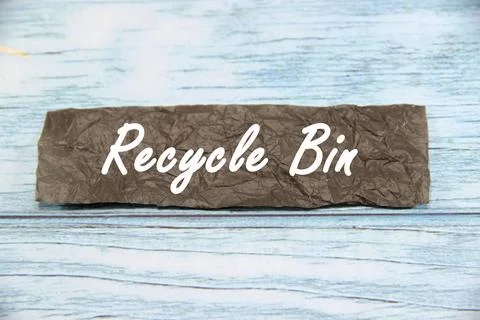 Recycle bin wording  or text on brown paper with blue background.Copy space.. Stock Photos