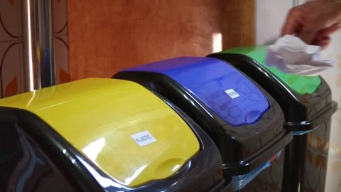 Recycle bins with hand dropping paper Stock Footage 287221249