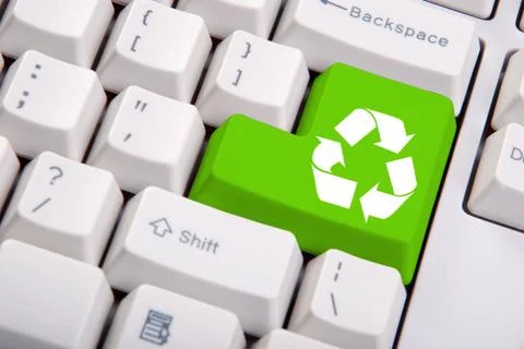 Recycle symbol on the computer keyboard Stock Photos