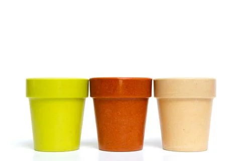 Recycled materials biodegradable tree pot isolated on a white background Stock Photos