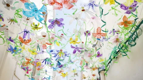 Recycled Plastic Bottles Repurposed Into Painted Hanging Decorations Stock Footage 254860436