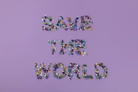 Recycled save the world text consisting of small plastic pellets 스톡 사진
