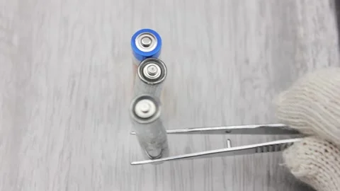 Recycling of AA batteries.Scientific processing of used AA batteries. Stock Footage 194288986