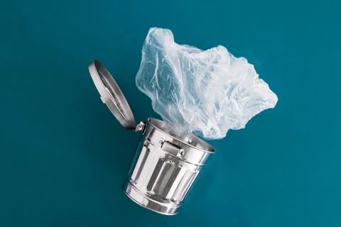 Recycling and avoiding landfill, open trash can with single use plastic bags  Stock Photos
