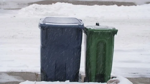 Recycling and garbage bins on sidewalk in snow. No logos. Toronto, Canada. Stock Footage 85960077