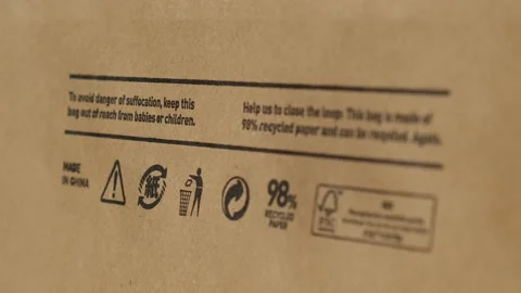Recycling bag Closeup view of pap sign and other eco-label on Brown paper bag Stock Footage 189117168