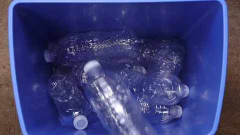 Recycling bin quickly filling up with plastic bottles Stock Footage 121985275
