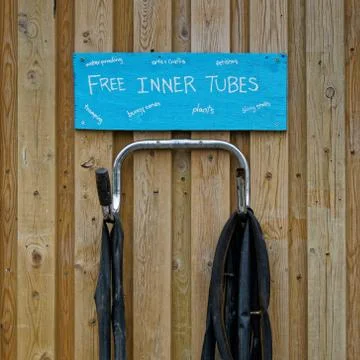 Recycling centre sign - rubber inner tubes for fetishes. Stock Photos