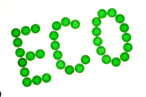 Recycling concept with Eco caption made of green plastic bottle caps Foto stock