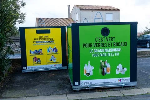 Recycling Containers With Sorting Posters On Asphalt Stock Photos