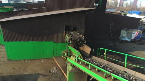 Recycling facility metal components resulted from cars disassembled are being Stock Footage 99511406
