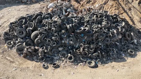 Recycling facility processing old car tires Video stock 294722817