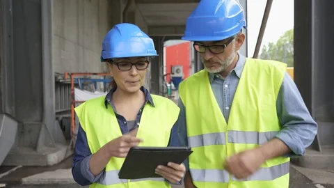 Recycling industry workers using tablet outside factory Stock Footage 89466343