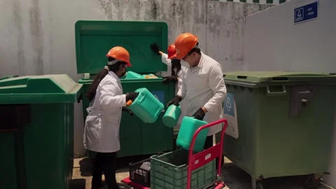 Recycling Plant Workers Sorting HDPE Plastic for Eco-Brick Production Stock Footage 346643758