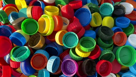 Recycling Plastic Bottle Caps. Plastic Material is Recyclable. Stock Footage 251917227