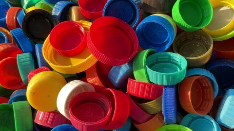 Recycling Plastic Bottle Caps. Plastic Material is Recyclable. Stock Footage 251952260