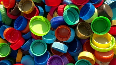 Recycling Plastic Bottle Caps. Plastic Material is Recyclable. Stock Footage 251952333