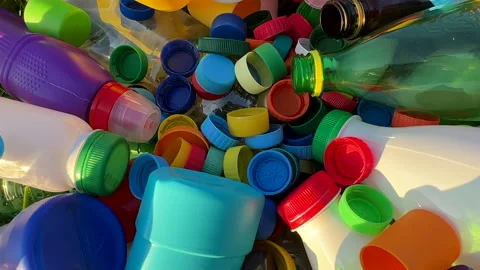 Recycling Plastic Bottle Caps. Plastic Material is Recyclable. Stock Footage 251957723
