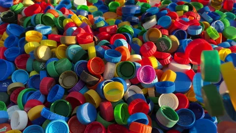 Recycling Plastic Bottle Caps. Plastic Material is Recyclable. Stock Footage 252751396
