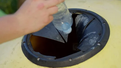 Recycling plastic bottles by disposing them into special container. Stock Footage 167043316