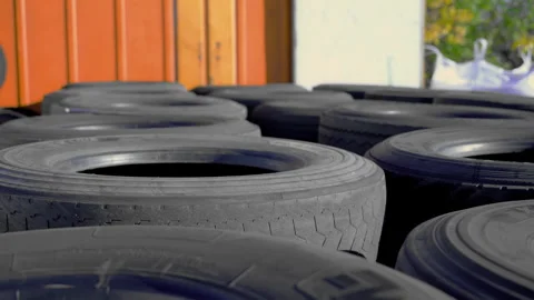 Recycling process of old tires. Rows of old wheels for recycling. Move camera Stock Footage 304400885