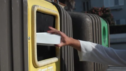 Recycling - Put packing in the yellow container. Stock Footage 89538442