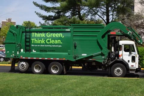 Recycling truck helping to keep the environment green Stock Photos