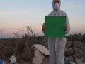 Recycling worker hold Big green screen  4k or 4k+ Resolution