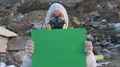 Recycling worker hold green table  4k or 4k+ Resolution