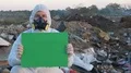 Recycling worker hold green table 4k or 4k+ Resolution