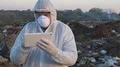 Recycling worker hold tablet  4k or 4k+ Resolution