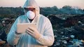 Recycling worker hold tablet  4k or 4k+ Resolution