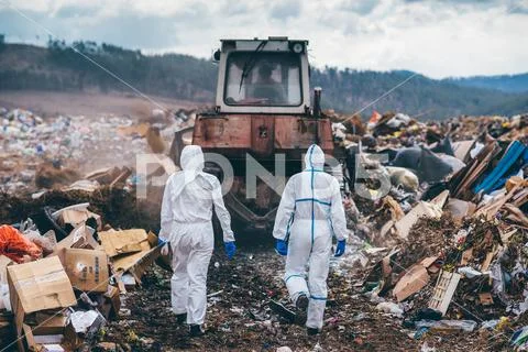 Recycling workers researching on the landfill Stock Photos