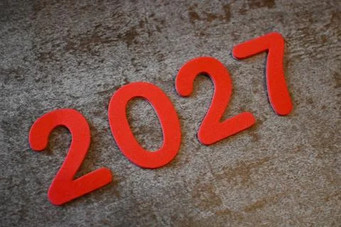 Red 2027 numerals on a textured surface Photos