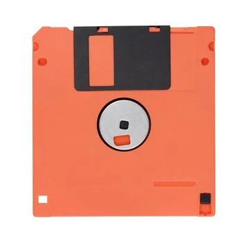 Red 3.5-inch floppy disk or diskette isolated on white Stock Photos