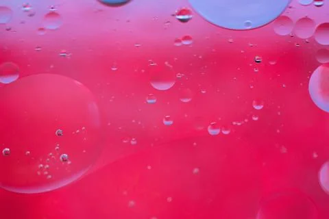 Red abstract background picture made with oil, water and soap Фото