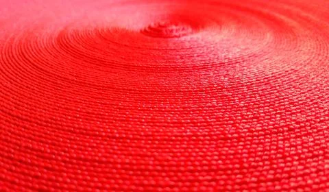 Red abstract circular pattern made of red sling. Stockfoto's