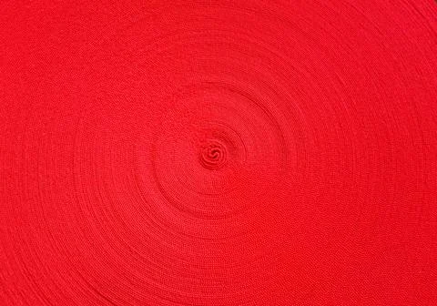 Red abstract circular pattern made of red sling Stockfoto's