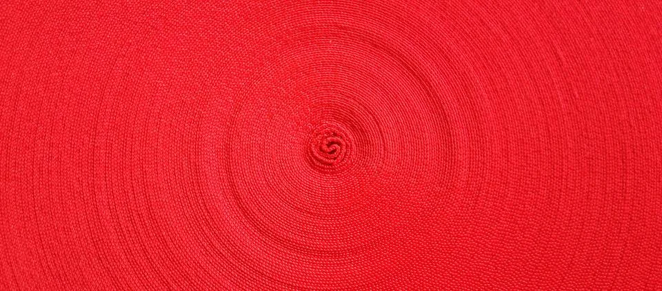 Red abstract circular pattern made of red sling Stockfoto's